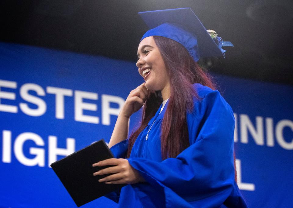 Worcester Technical High School graduate Jayla Amani Familia walks across the stage with her diploma during the school's graduation exercises at the DCU Center on Friday, June 10, 2022. Jayla is the daughter of fallen Worcester Police Officer Enmanuel ''Manny'' Familia.