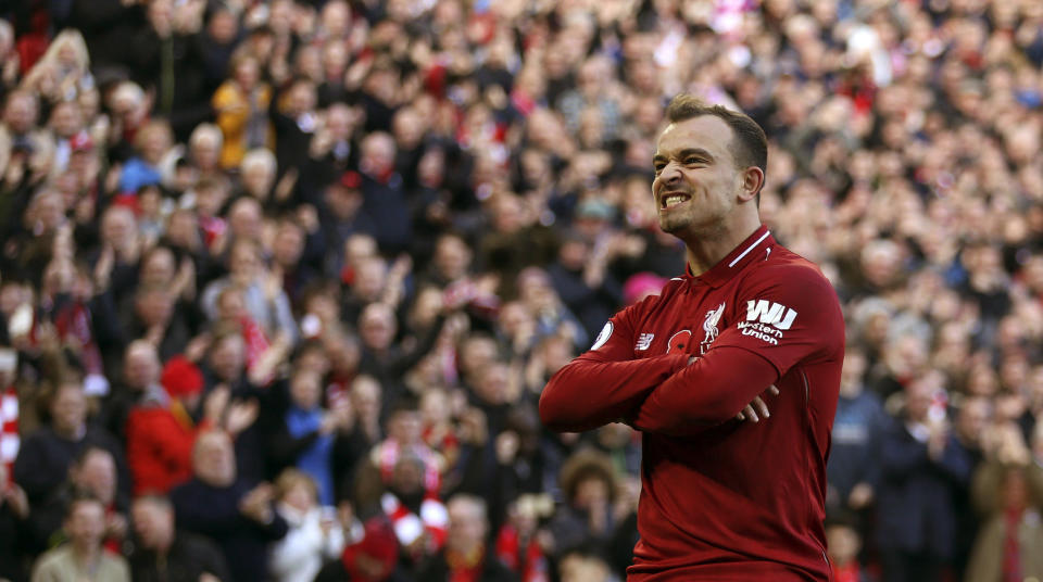 Liverpool's Xherdan Shaqiri celebrates scoring his side's second goal of the game, during the English Premier League soccer match between Liverpool and Fulham, at Anfield Stadium, in Liverpool, England, Sunday, Nov. 11, 2018. (Barrington Coombs/PA via AP)