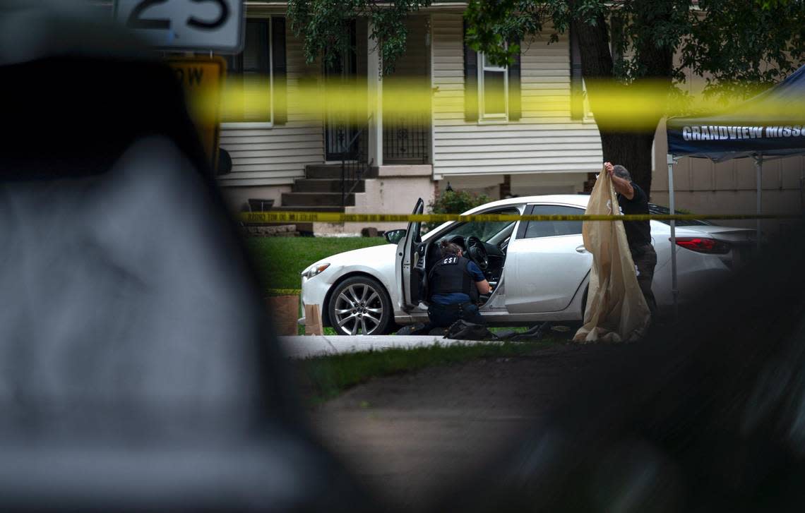 Police clean up the crime scene of a fatal shooting that left one person dead on Wednesday, Aug. 2, 2023, in Grandview. The suspect is accused of shooting two people and killing a third person at three different locations, including two in Kansas City, on Wednesday morning. Zachary Linhares/zlinhares@kcstar.com