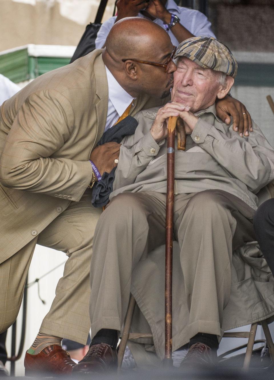Newport Jazz Festival artistic director Christian McBride gives George Wein a kiss as McBride takes the stage to perform with his big band in 2017.
