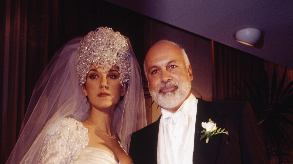 a man and woman in wedding attire