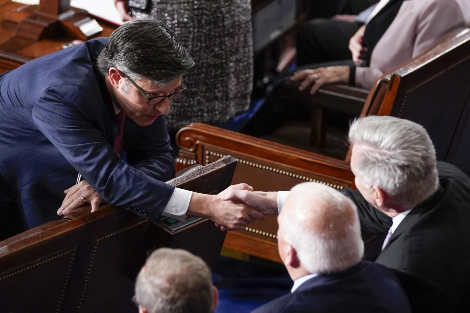 FILE - Rep. Mike Johnson, R-La., shakes hands with Rep. Kevin McCarthy, R-Calif., before Republicans try to elect Johnson to be the new House speaker, at the Capitol in Washington, Oct. 25, 2023. Johnson is facing his first big test as he tries to win House Republican support for a short-term funding plan to avert a government shutdown. (AP Photo/Alex Brandon, File)