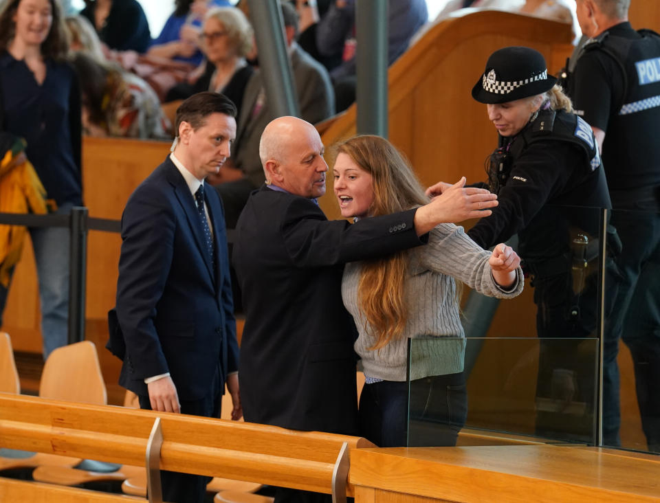 Protesters disrupted proceedings at First Minister’s Questions five times before the Presiding Officer cleared the public gallery (Andrew Milligan/PA)