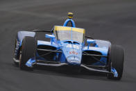 Jimmie Johnson drives through the first turn during qualifications for the Indianapolis 500 auto race at Indianapolis Motor Speedway in Indianapolis, Saturday, May 21, 2022. (AP Photo/Michael Conroy)