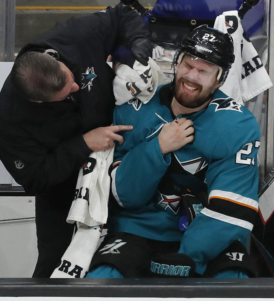 San Jose Sharks' Joonas Donskoi (27) gets medical attention on the bench in the third period in Game 5 of the NHL hockey Stanley Cup Western Conference finals against the St. Louis Blues in San Jose, Calif., on Sunday, May 19, 2019. (AP Photo/Josie Lepe)