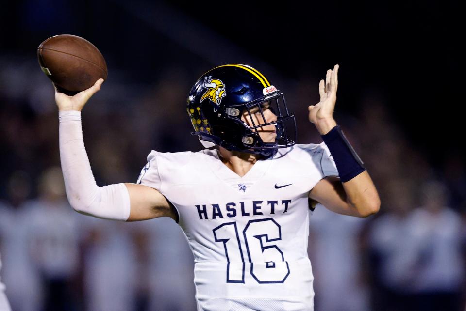 Haslett quarterback Erik Lardie throws against Mason, Friday, Sept. 22, 2023, in Mason.