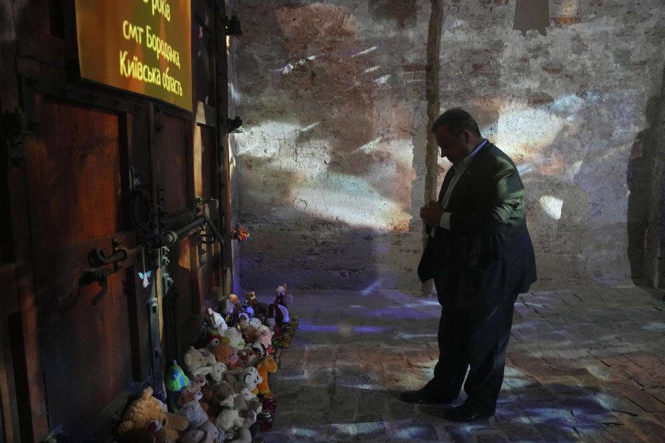 Republican presidential candidate former New Jersey Gov. Chris Christie pays tribute to Ukrainian children killed during Ukrainian-Russian war in the National Museum of the History of Ukraine in the Second World War, Kyiv, Ukraine, Friday, Aug. 4, 2023. (AP Photo/Efrem Lukatsky)