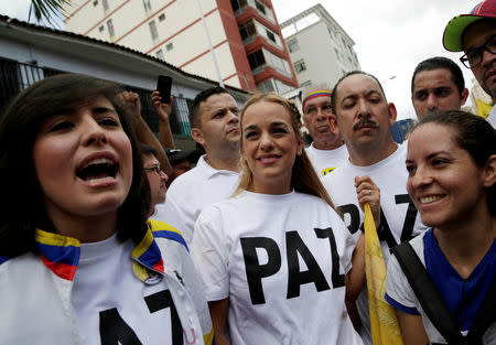 Lilian Tintori (C), wife of jailed Venezuelan opposition leader Leopoldo Lopez, takes part in a rally to demand a referendum to remove Venezuela's President Nicolas Maduro in Caracas, Venezuela, September 1, 2016. REUTERS/Marco Bello