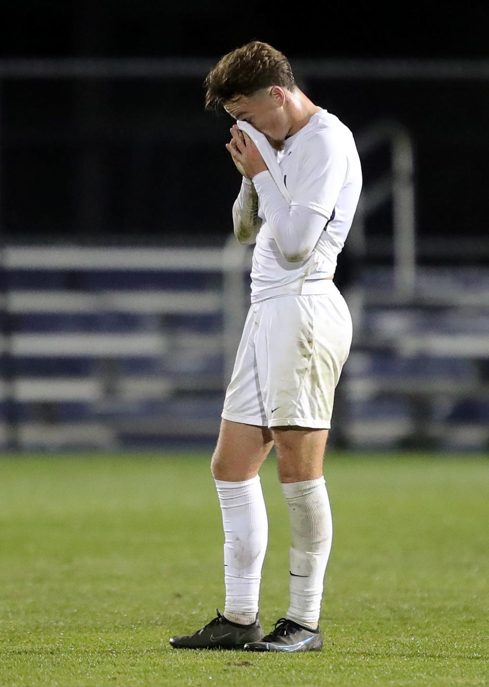 Akron midfielder Dyson Clapier (19) reacts after the Zips tied 0-0 in an NCAA college soccer game against Michigan, Monday, Oct. 18, 2021, in Akron, Ohio.
