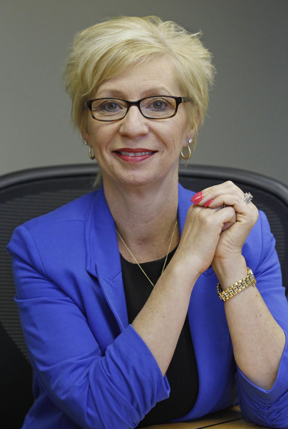 This Friday, June 15, 2012 photo shows Kathy Miller, president of Total Event Resources, at her offices in Schaumburg, Ill. In 2008, her events planning company was having its best year ever. She and her husband had set aside money to put their two sons through college, with enough left in savings for "a very nice life" in the Chicago suburb. Then the financial crisis sent the stock market tumbling and the corporate customers who had kept Miller's company busy, stopped calling. When the government reported that the Great Recession claimed nearly 40 percent of Americans' wealth, the figure alarmed economists. But for families across the country, the numbers merely confirm that they are not alone. (AP Photo/M. Spencer Green)