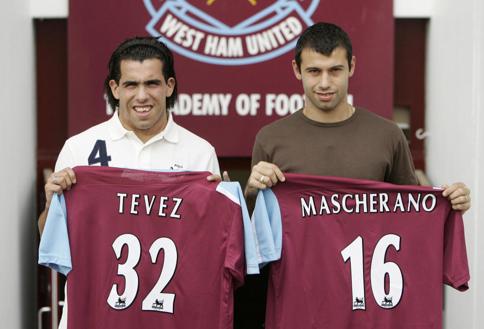 Carlos Tevez and Javier Mascherano look slightly bemused as they are unveiled as West Ham players