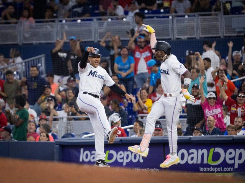 Miami Marlins center fielder Jazz Chisholm Jr. (2) jumps up after hitting a grand slam during the third inning of a baseball game on Sunday, Sept. 17, 2023, at loanDepot Park in Miami, Fla.