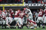 Alabama place kicker Will Reichard has a field goal attempt blocked during the second half of the College Football Playoff championship football game against Georgia Monday, Jan. 10, 2022, in Indianapolis. (AP Photo/Paul Sancya)