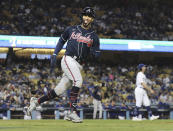 Atlanta Braves' Eddie Rosario reacts to his three-run home run in the ninth inning off Los Angeles Dodgers pitcher Tony Gonsolin, right, during Game 4 of the baseball NL Championship Series, Wednesday, Oct. 20, 2021, in Los Angeles. (Curtis Compton/Atlanta Journal-Constitution via AP)