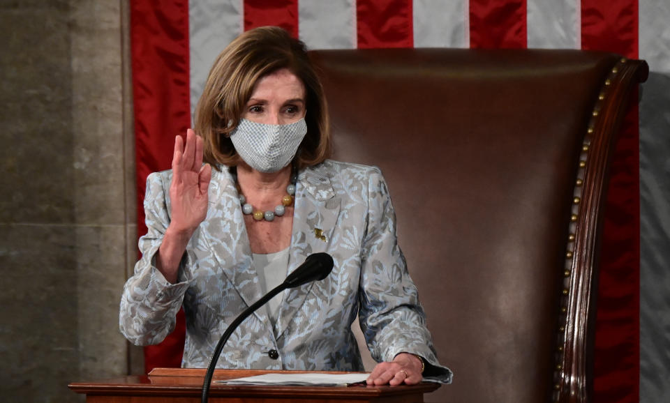 House Speaker Nancy Pelosi takes her oath of office as the Speaker of the 117th Congress after being re-elected at the U.S. Capitol in Washington, Sunday, Jan. 3, 2021. (Erin Scott/Pool via AP)