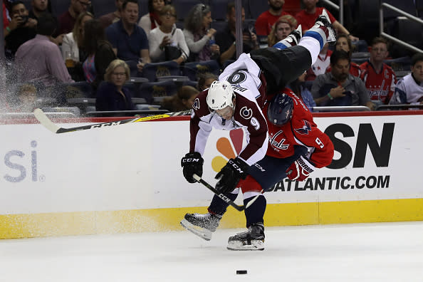 WASHINGTON, DC - OCTOBER 18: Matt Duchene #9 of the Colorado Avalanche flips over Dmitry Orlov #9 of the Washington Capitals in the first period at Verizon Center on October 18, 2016 in Washington, DC. (Photo by Rob Carr/Getty Images)