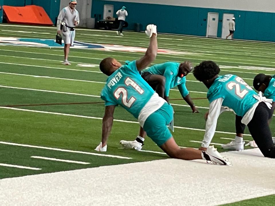 Dolphins safety Jordan Poyer stretches before Tuesday's practice.