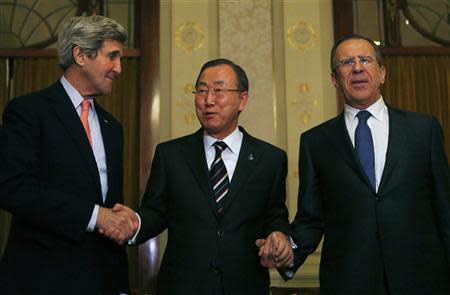 U.S. Secretary of State John Kerry (L-R), U.N. Secretary-General Ban Ki-moon and Russia's Foreign Minister Sergey Lavrov join hands after their tri-lateral meeting in Montreux, Switzerland, January 21, 2014. REUTERS/Gary Cameron