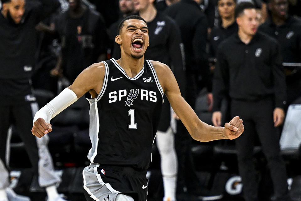 San Antonio Spurs rookie Victor Wembanyama celebrates after winning his first NBA game on Oct. 27, 2023. (Photo by CHANDAN KHANNA/AFP via Getty Images)