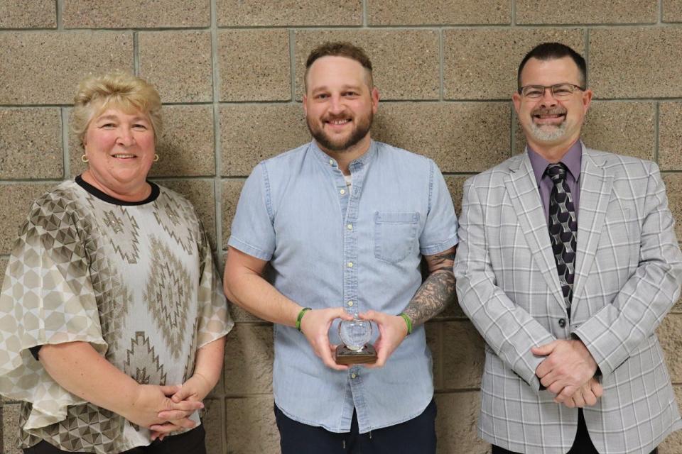 Kay Schwab (First Community Credit Union), Tyler Marquart (DLHS social studies), Ryan Hanson (DLHS principal)