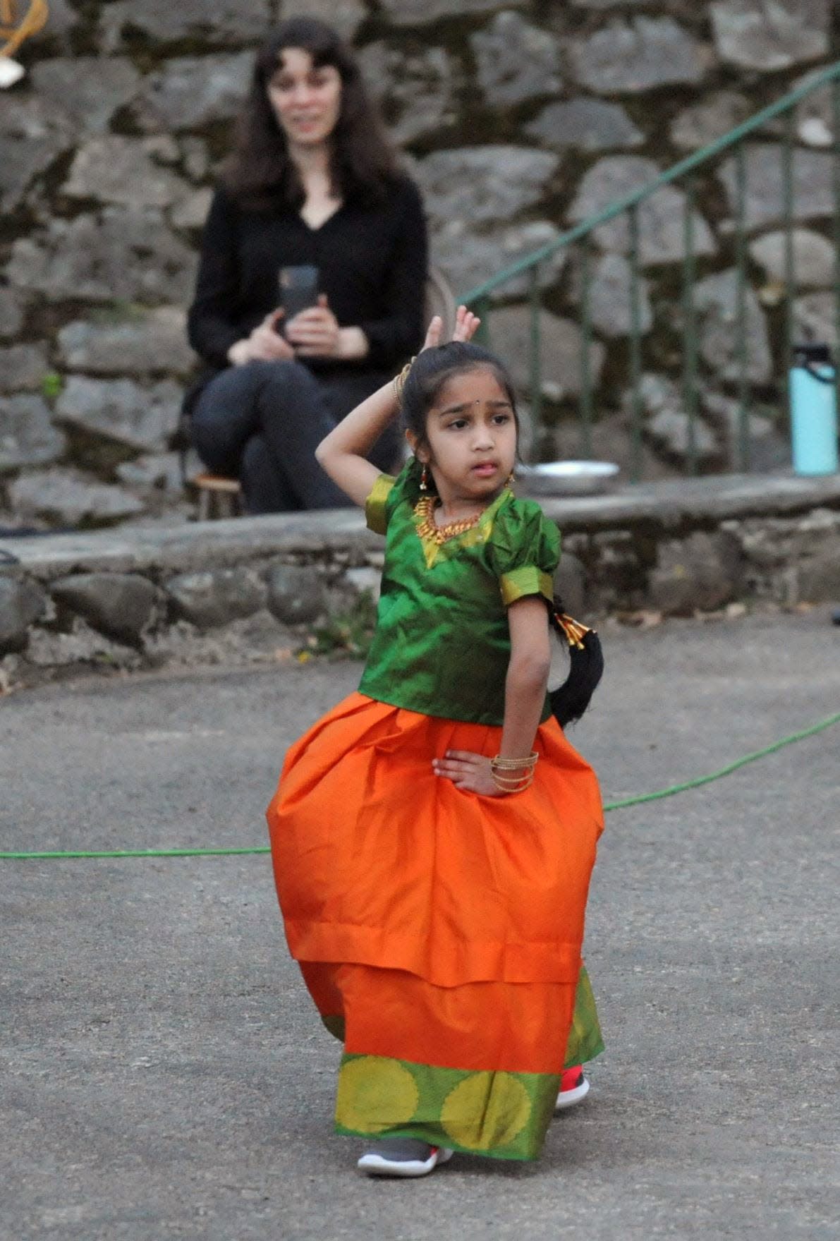 Dressed in attire from her native India, Sruti Maruvada, 6, of Quincy, performs a dance during the Quincy Multicultural Festival at Pageant Field on Thursday, May 5, 2022.