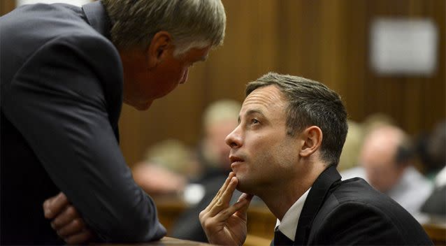 Oscar Pistorius (right) speaks with defence lawyer Brian Webber in court in Pretoria, South Africa. Photo: AP