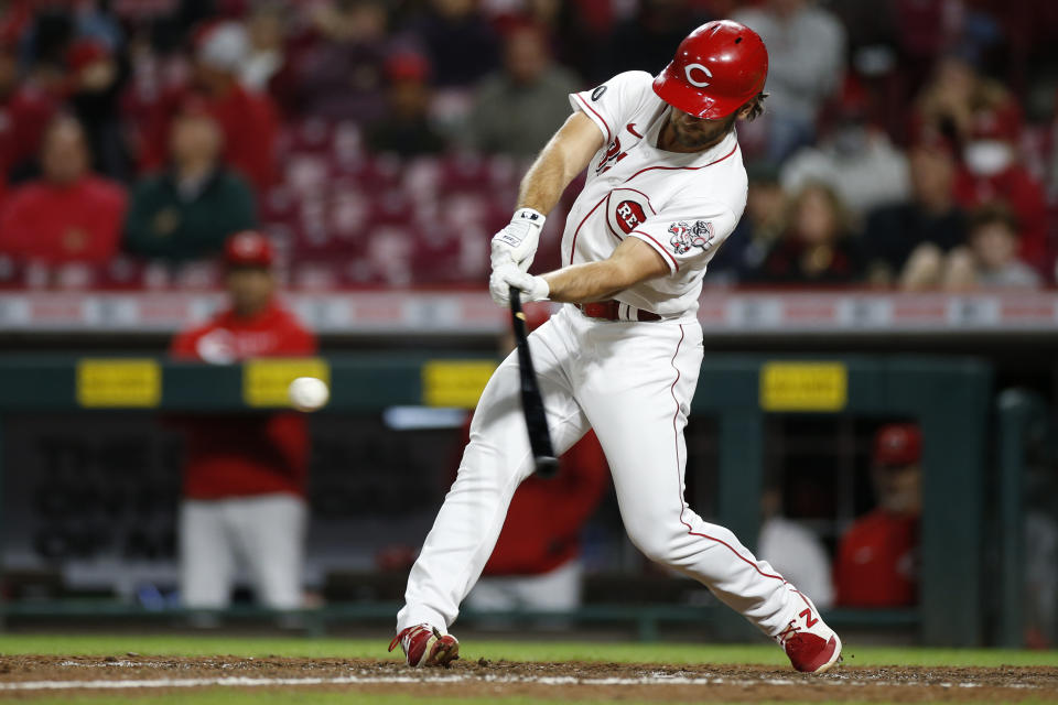 Cincinnati Reds' Max Schrock hits a triple against the Washington Nationals during the ninth inning of a baseball game Thursday, Sept. 23, 2021, in Cincinnati. The Nationals beat the Reds 3-2. (AP Photo/Jay LaPrete)