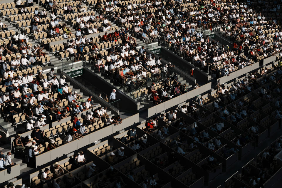 Spectators watch Serbia's Novak Djokovic against Spain's Rafael Nadal during their semifinal match of the French Open tennis tournament at the Roland Garros stadium Friday, June 11, 2021 in Paris. (AP Photo/Thibault Camus)