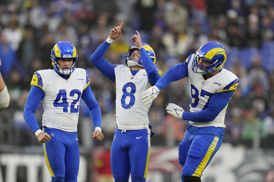 Los Angeles Rams place kicker Lucas Havrisik (8) celebrate his made field goal against the Baltimore Ravens with Rams linebacker Michael Hoecht (97) and Rams punter Ethan Evans (42) during the first half of an NFL football game Sunday, Dec. 10, 2023, in Baltimore. (AP Photo/Alex Brandon)
