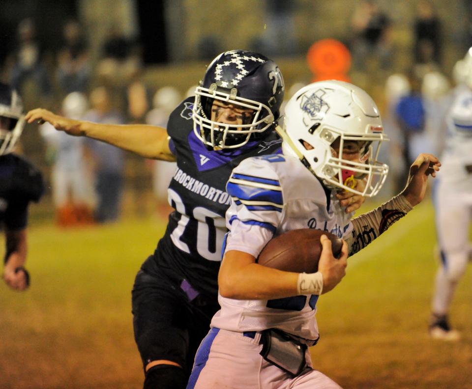 Throckmorton defensive end Canon Redwine prepares to tackle a Rule wide receiver on Friday, Oct. 1, 2021.