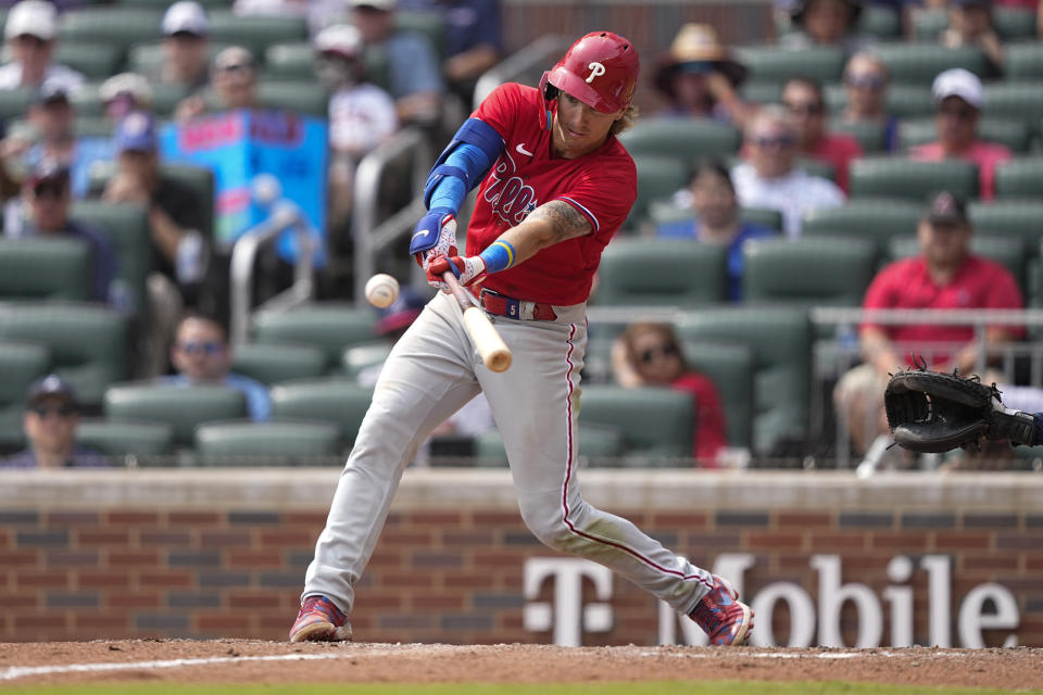 Philadelphia Phillies' Alec Bohm (28) hits a double in the tenth inning of a baseball game against the Atlanta Braves,Wednesday, Sept. 20, 2023, in Atlanta. (AP Photo/Brynn Anderson)