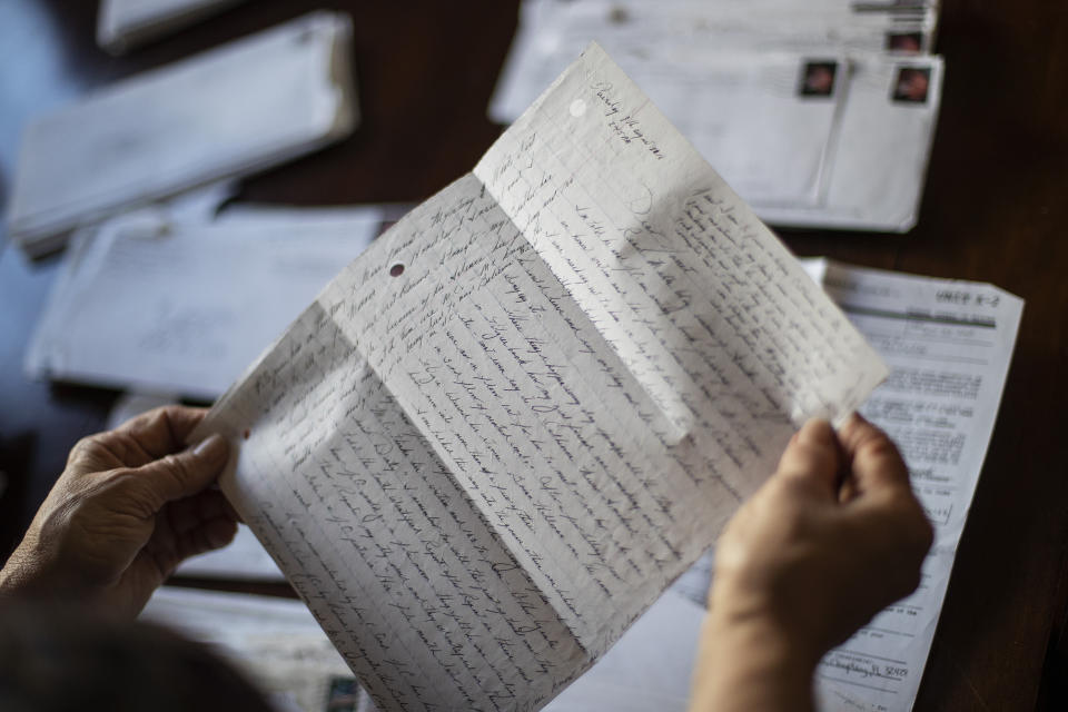 Janet Uhlar holds a letter she received through her correspondence with imprisoned Boston organized crime boss James "Whitey" Bulger, Friday, Jan. 31, 2020, in Eastham, Mass. "Had I known, I would have absolutely held off on the murder charges," said Uhlar, noting that Bulger's role in the experiments was never mentioned during his extended federal trial. "He didn't murder prior to the LSD. His brain may have been altered, so how could you say he was guilty?" (AP Photo/David Goldman)