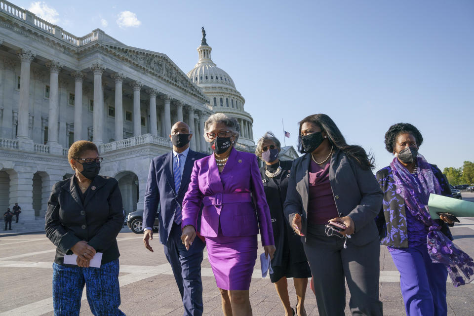 Members of the Congressional Black Caucus walk to make a make a statement on the verdict in the murder trial of former Minneapolis police Officer Derek Chauvin in the death of George Floyd, on Capitol Hill in Washington, Tuesday, April 20, 2021.  / Credit: J. Scott Applewhite / AP