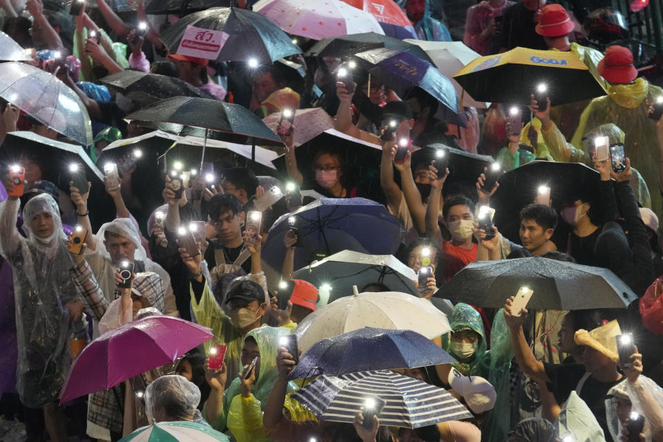 Supporters of the Move Forward Party display mobile phones with flash lights on during a protest in Bangkok, Thailand, Sunday, July 23, 2023. The demonstrators are protesting that Thailand's Constitution is undemocratic, because it allowed Parliament to block the winner of May's general election, the Move Forward Party, from naming its leader named the new prime minister, even though he had assembled an eight-part coalition that had won a clear majority of seats in the House of Representatives. (AP Photo/Sakchai Lalit)