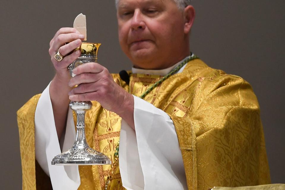 Knoxville Catholic Bishop Richard Stika holds Easter mass at the Cathedral of the Most Sacred Heart of Jesus in Knoxville, Sunday April 12, 2020.
