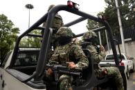 Mexican navy marines patrol in Mexico City on July 16, 2013