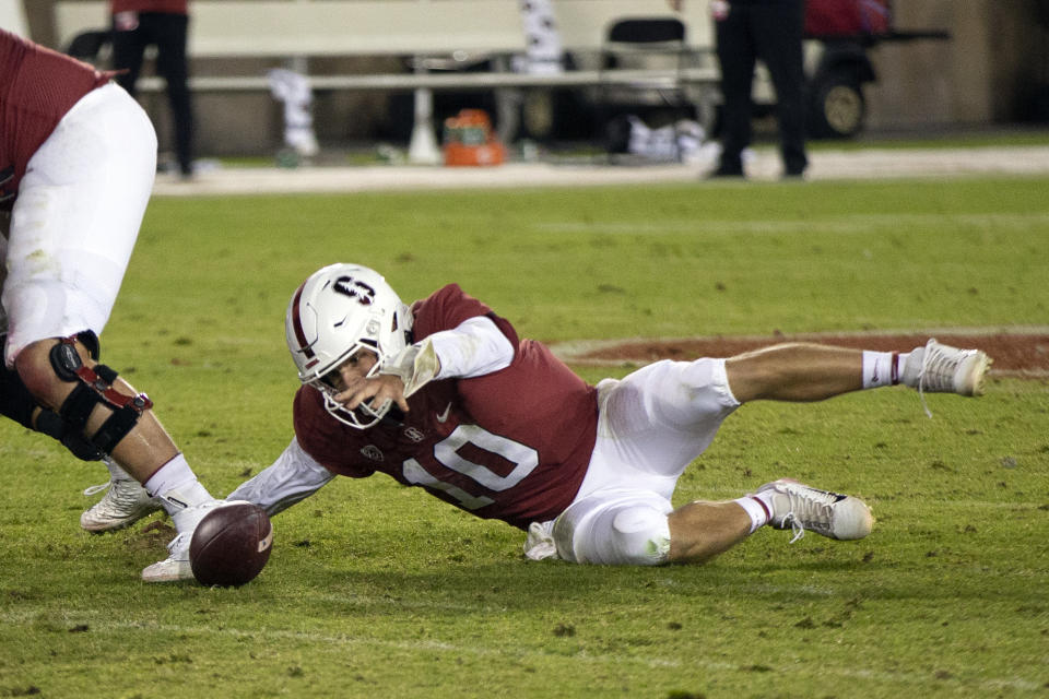 Stanford quarterback Jack West (10) chases in vain after his fumble against Utah during the fourth quarter of an NCAA college football game, Friday, Nov. 5, 2021, in Stanford, Calif. (AP Photo/D. Ross Cameron)