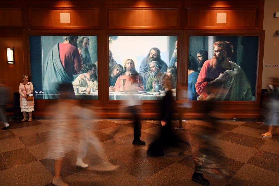 Conferencegoers walk past a painting during the Saturday afternoon session of the 193rd Semiannual General Conference of The Church of Jesus Christ of Latter-day Saints at the Conference Center in Salt Lake City on Saturday, Sept. 30, 2023. | Scott G Winterton, Deseret News
