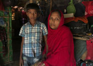 Rohingya refugees Sitara Begum with her son Mohammed Abbas, who are in the list for repatriation wait in their shelter at Jamtoli refugee camp, near Cox's Bazar, Bangladesh, Thursday, Nov. 15, 2018. Bangladesh authorities said Thursday that repatriation to Myanmar of some of the more than 700,000 Rohingya Muslims who fled army-led violence will begin as scheduled if people are willing to go, despite calls from United Nations officials and human rights groups for the refugees' safety in their homeland to be verified first. (AP Photo/Dar Yasin)