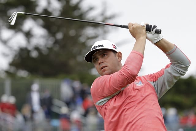 Overnight leader Gary Woodland moved two shots clear at Pebble Beach