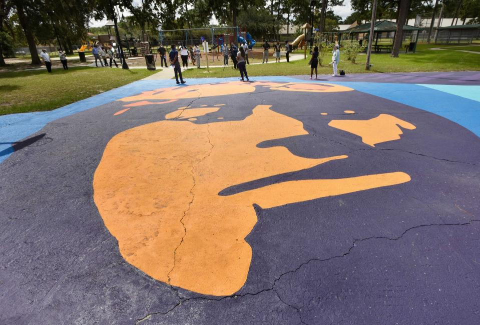 A basketball court mural, a stylized portrait of pilot Bessie Coleman titled "Fly High," was dedicated in 2020 at Warrington Park for an Arlington revitalization project in Jacksonville.