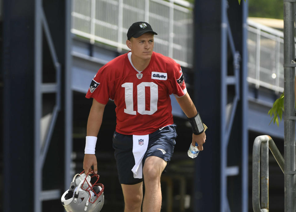 May 23, 2022; Foxborough, MA, USA; New England Patriots quarterback Mac Jones (10) heads to the practice field for the team's OTA at Gillette Stadium. Mandatory Credit: Eric Canha-USA TODAY Sports