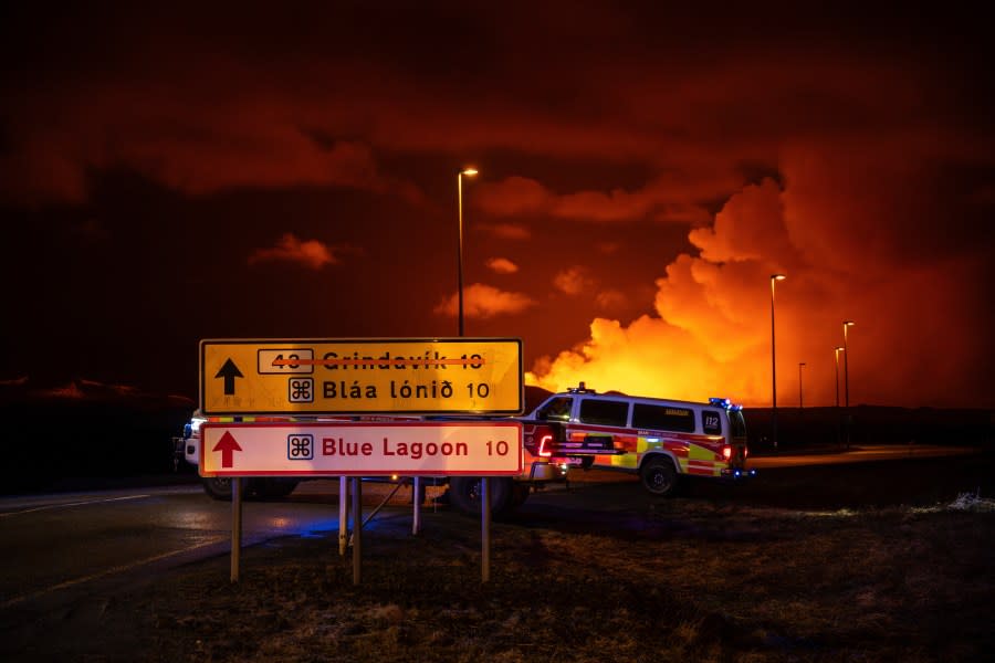 Emergency vehicles are stationed on a road leading to volcanic activity between Hagafell and Stóri-Skógfell, Iceland, on Saturday, March 16, 2024. (AP Photo/Marco di Marco)