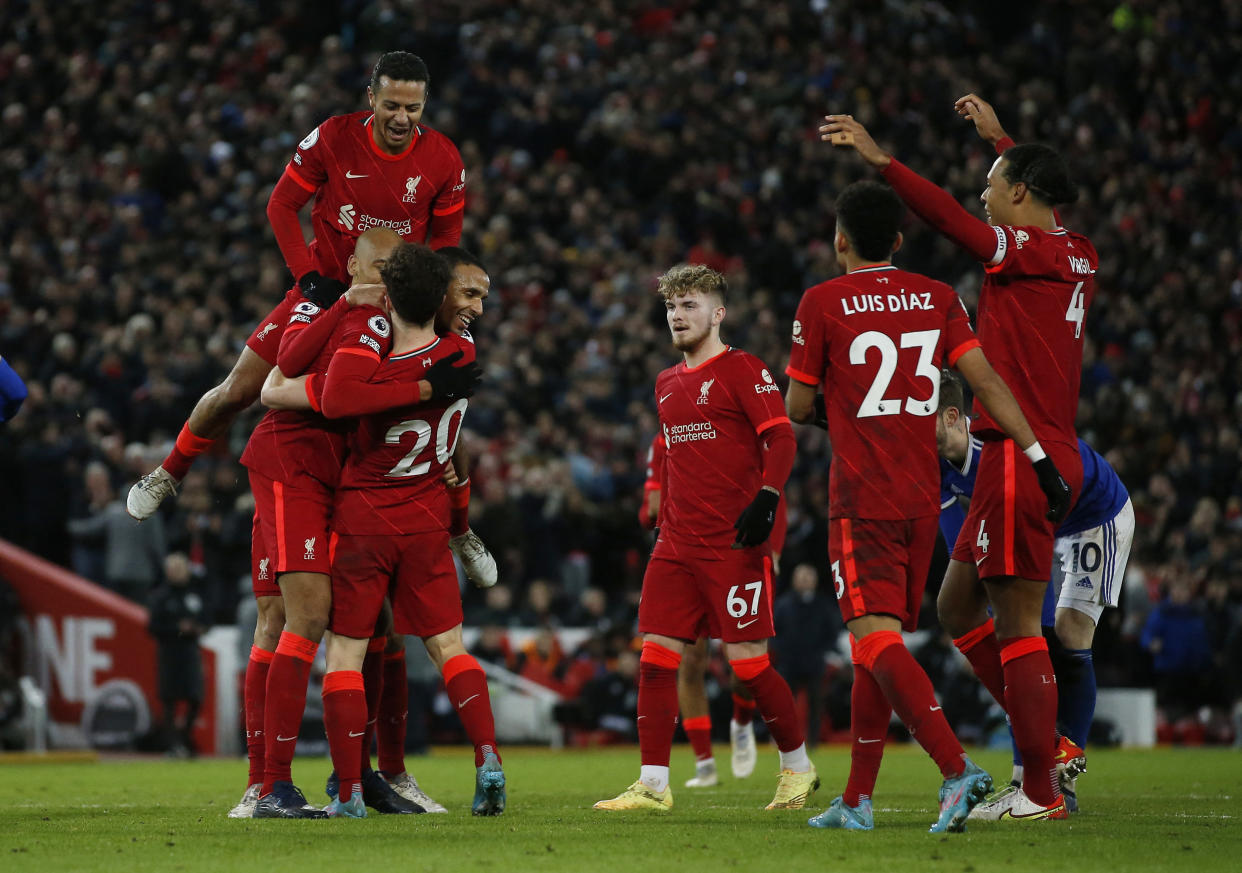 Liverpool players celebrate scoring against Leicester City in their English Premier League clash. 