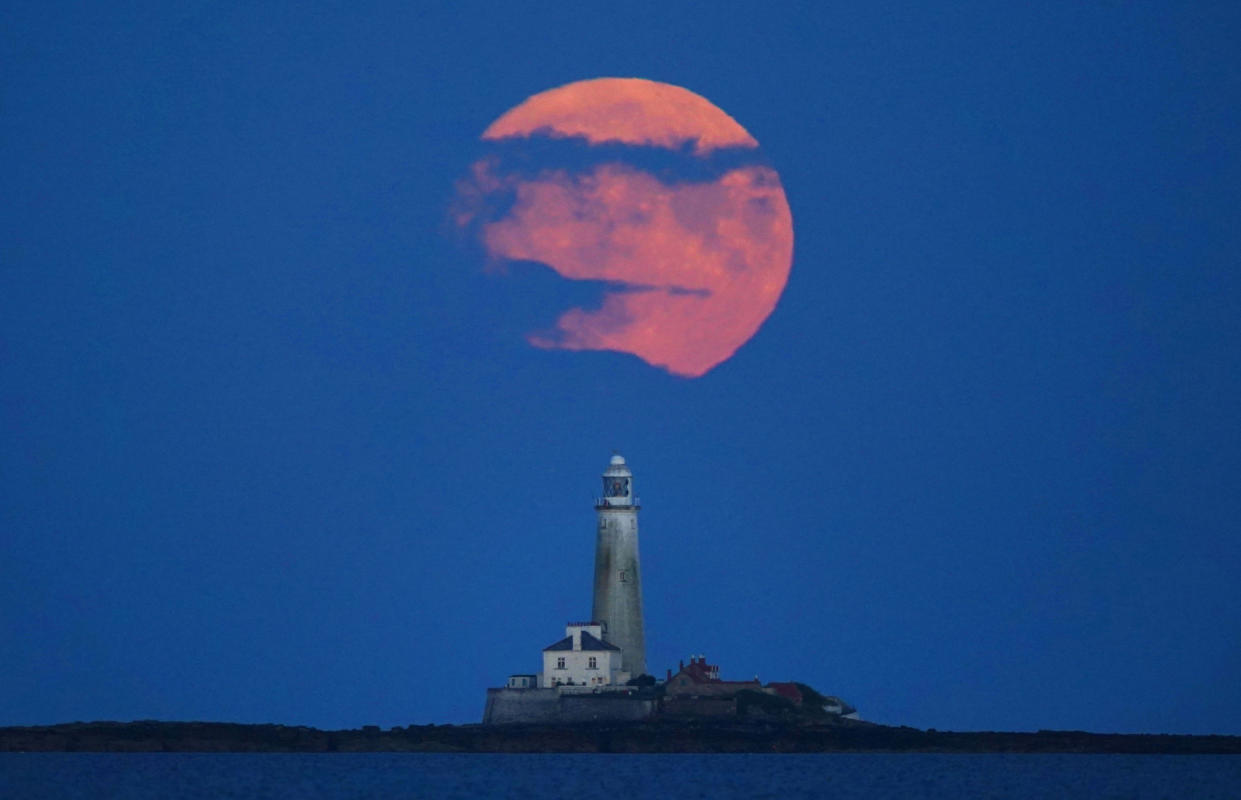 The Full Buck supermoon rises over St Mary's Lighthouse in Whitley Bay, on the North East coast of England. The July supermoon is arriving to its closest point to Earth at 224,895 miles (361,934km) - around 13,959 miles (22,466km) closer than usual. It appears 5.8 per cent bigger and 12.8 per cent brighter than an ordinary full moon. Picture date: Sunday July 2, 2023. (Photo by Owen Humphreys/PA Images via Getty Images)