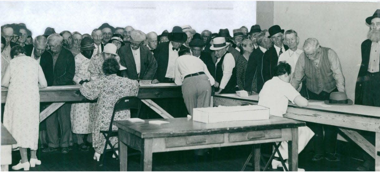 Summit County residents file for old age pensions June 18, 1934, in the former Ohio Bell office at 76 S. High St. in downtown Akron.