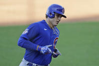 Chicago Cubs' Anthony Rizzo rounds the bases after hitting a solo home run in the third inning in a baseball game against the Cleveland Indians, Wednesday, Aug. 12, 2020, in Cleveland. (AP Photo/Tony Dejak)