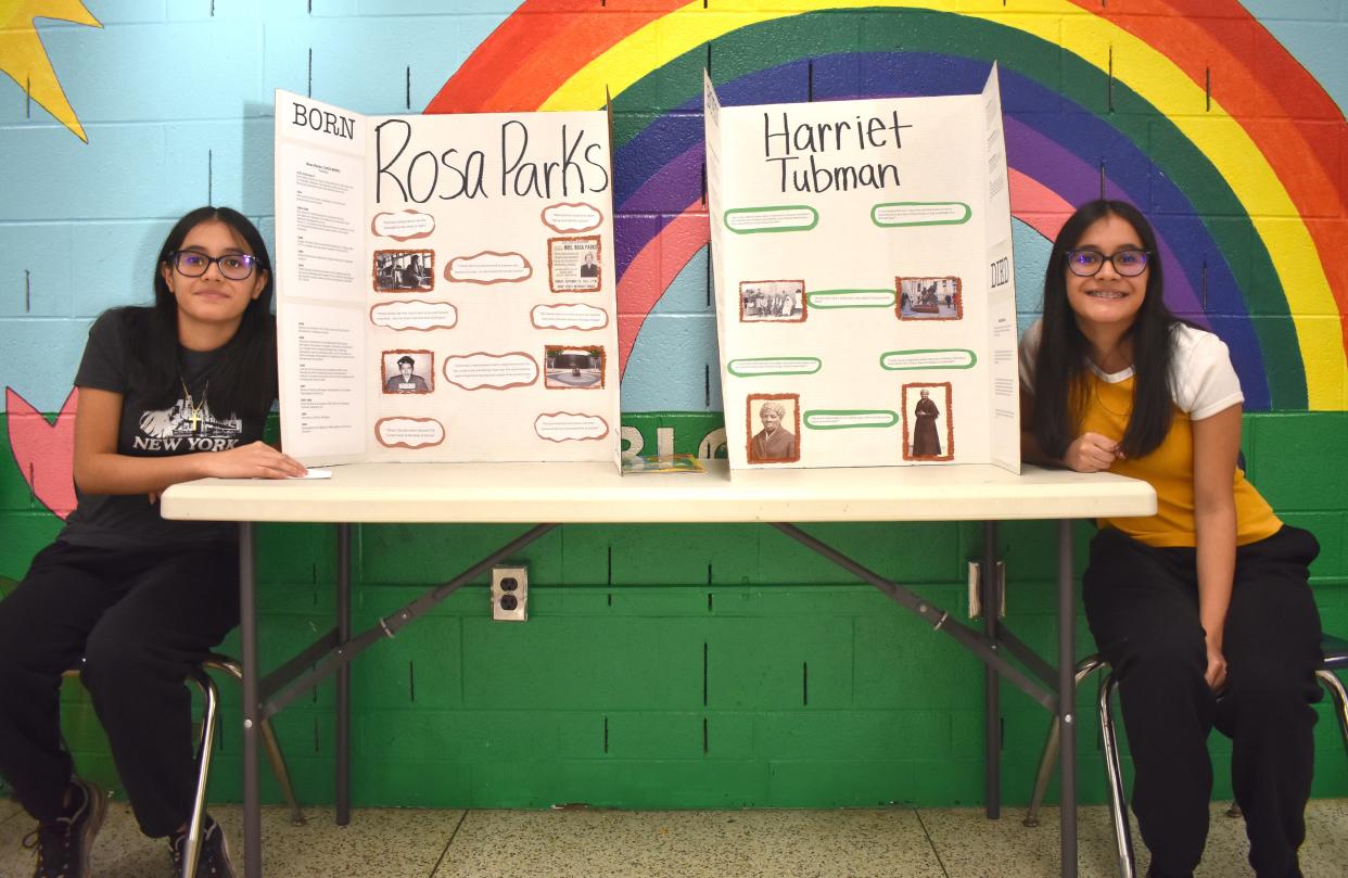 Sisters Annabel Ramirez, 17, left, and Alexis Ramirez, 17, display their biography exhibits during the inaugural Black History Month biography fair Feb. 1 at the Boys & Girls Club of Lenawee. Annabel chose to make her biography exhibit about Rosa Parks, while Alexis selected Harriet Tubman.