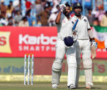 Cricket - India v England - First Test cricket match - Saurashtra Cricket Association Stadium, Rajkot, India - 11/11/2016. India's Murali Vijay (L) celebrates after scoring his century. REUTERS/Amit Dave