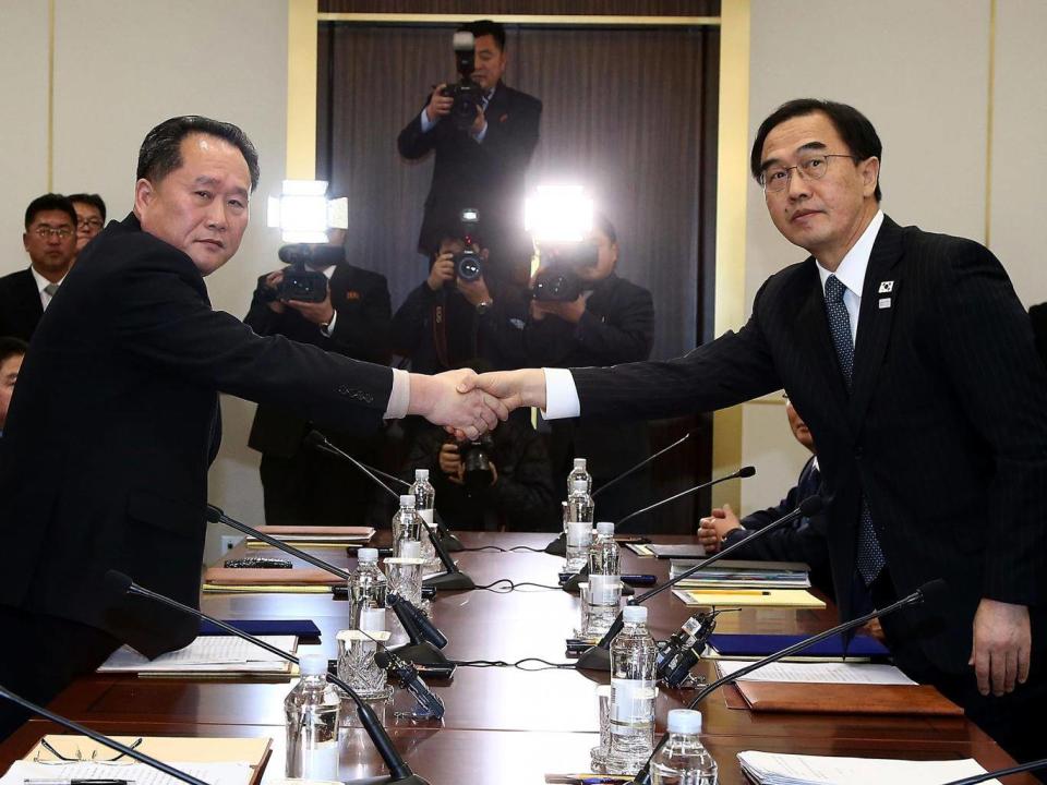 South Korean Unification Minister Cho Myoung-Gyon (R) shakes hands with the head of the North Korean delegation Ri Son-Gwon during talks this week (Getty)